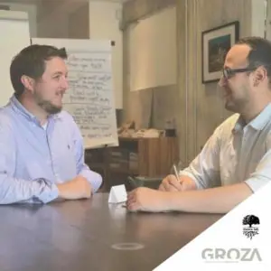 Two colleagues in a leadership training workshop at a table